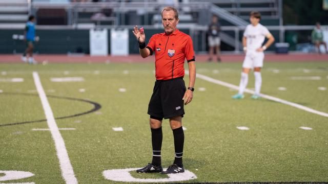 Official, referee. Enloe and Cardinal Gibbons battled to a 2-2 tie in a Cap 6 Conference boy soccer game on Thursday, October 12, 2023. (Photo By: Nick Stevens/HighSchoolOT)
